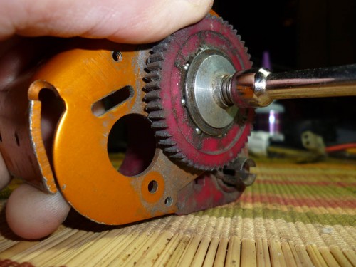 Take your 1/4&quot; Nut Driver and remove the Plastic Spur Gear. Being careful not to lose the metal balls from the gear. There should be 8 of the metal balls in the spur gear.