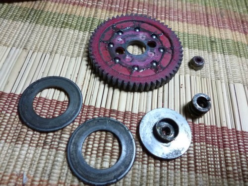 Here is the spur gear and the two drive rings, diff outer hub, diff spring and diff nut. After cleaning they can be evaluated to see what needs to be replaced. AT first glance they look pretty hosed!