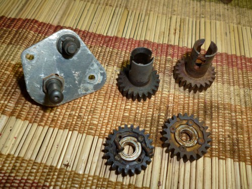 All of these gears came off after a few hours of soaking in the solvent. It's important not to use too much force. You could bend the spine plate or the gear shafts. Most will come off fairly easy if you just give the them enough time. Also The drive gear pivot #6609 and the Idle Gear Pivot #6610 are discolored. If you were just replacing with bushings this would be a major problem. However if you are using bearings most of these will be OK. Where you could run into problems is if the bearing center race spins freely on either of these pivots. In that case they would need to be replaced.