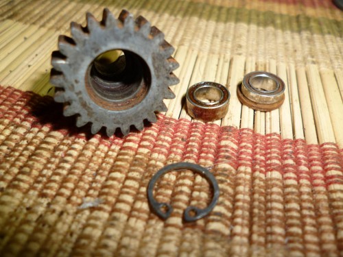 Here is the outdrive gear with the 2 super rusted bearings removed. If your 6 gear tranny is older or not upgraded there would only be one brass bushing here instead of the 2 bearings. In either case it is recommended to replace these bearings rather than try and reuse them. That is your choice of course.